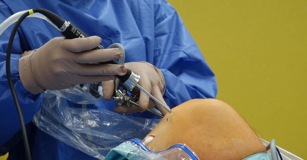 Surgeon using arthroscope for precise knee surgery in operating room.